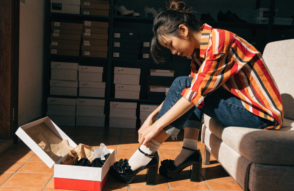 a-woman-tries-on-new-shoes.png